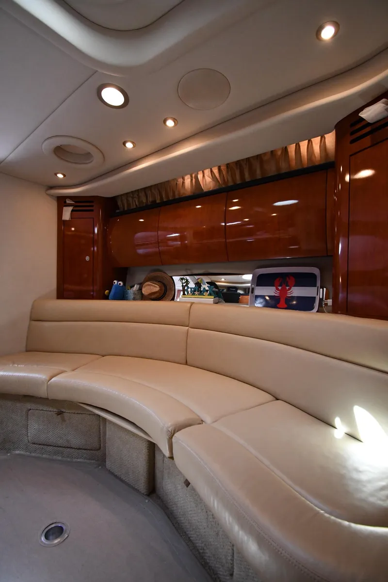 Slide: The Image of Luxurious interior of 2004 Sea Ray 360 Sundancer with plush seating and elegant wood finishes. - 39
