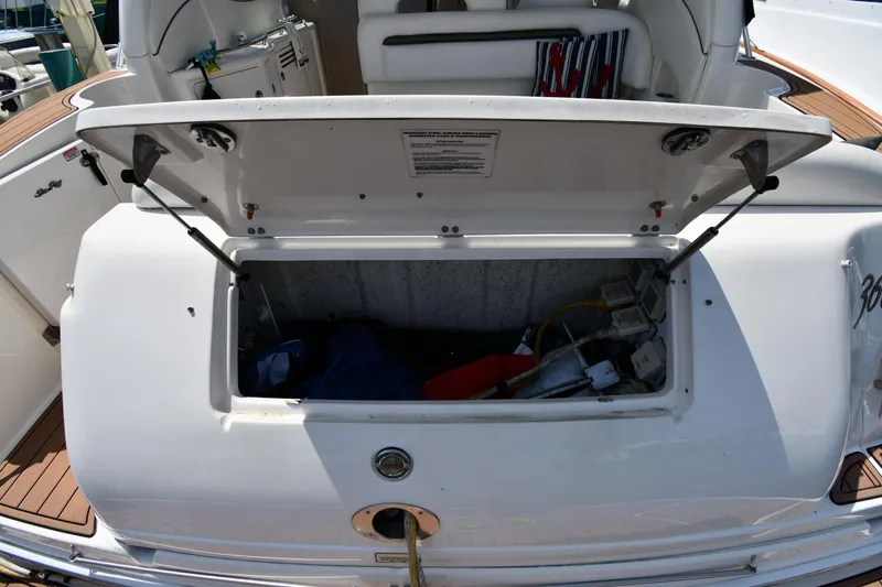Slide: The Image of Open storage compartment on a 2004 Sea Ray 360 Sundancer boat. - 25