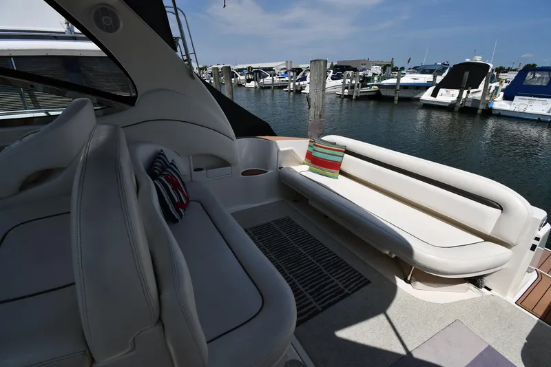 Slide: The Image of 2004 Sea Ray 360 Sundancer yacht interior with seating, docked at marina. - 29
