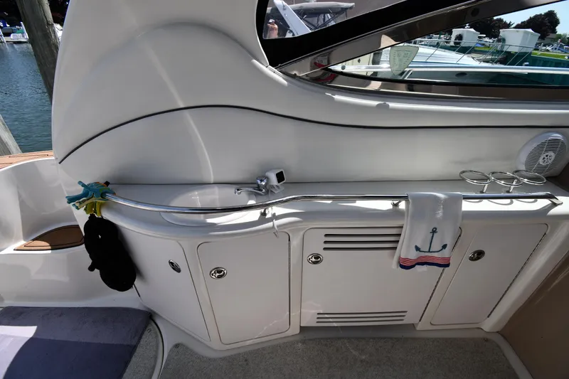 Slide: The Image of Interior view of a 2004 Sea Ray 360 Sundancer yacht with storage cabinets. - 26