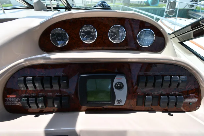 Slide: The Image of Control panel of 2004 Sea Ray 360 Sundancer boat with gauges and switches. - 17