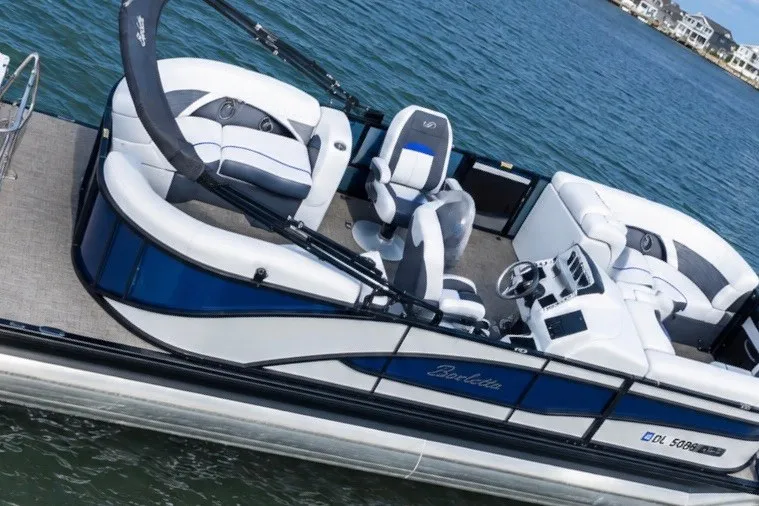 Slide: The Image of 2023 Barletta Corsa 21Q pontoon boat on water, featuring sleek design and comfortable seating. - 3
