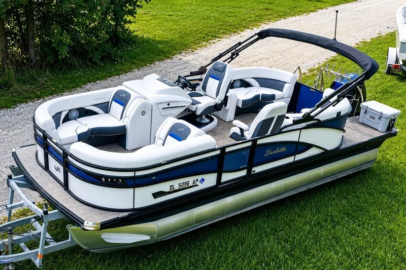 Slide: The Image of 2023 Barletta Corsa 21Q pontoon boat on grass, featuring sleek design and comfortable seating. - 4