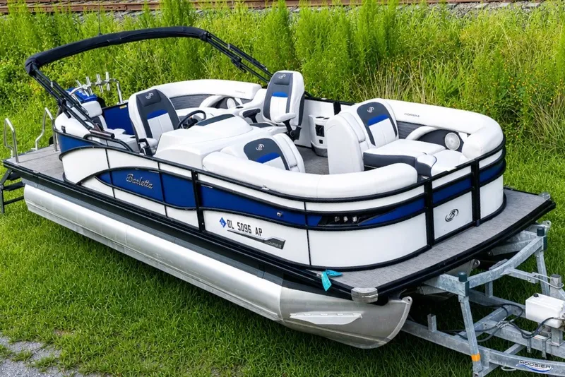 The Image of 2023 Barletta Corsa 21Q pontoon boat on trailer, featuring sleek design and comfortable seating. - 0