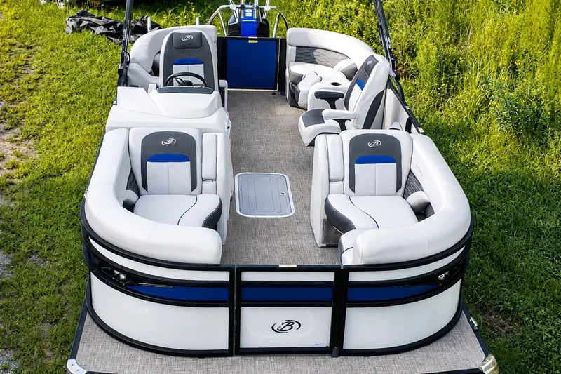 Slide: The Image of 2023 Barletta Corsa 21Q pontoon boat with luxurious seating on grassy background. - 5