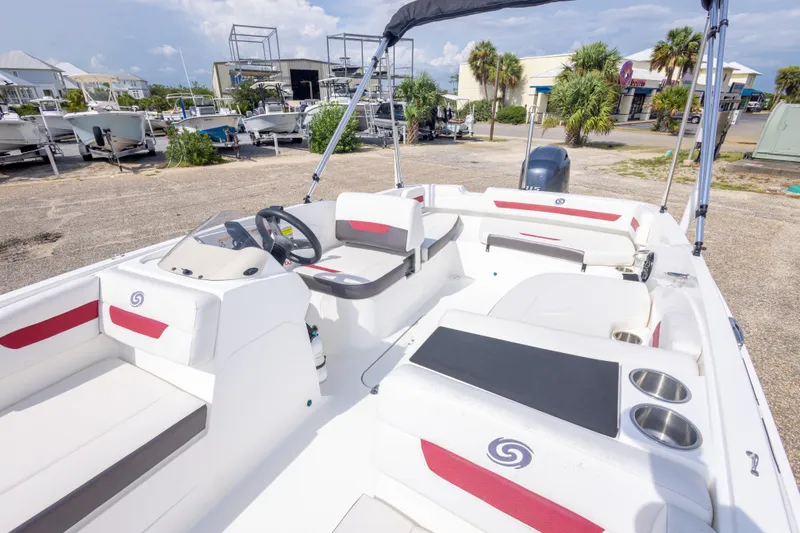 Slide: The Image of 2021 Hurricane SunDeck Sport 185 OB boat interior with seating and steering wheel. - 29