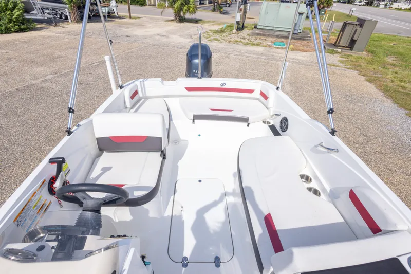 Slide: The Image of 2021 Hurricane SunDeck Sport 185 OB boat interior with seating and steering wheel. - 30