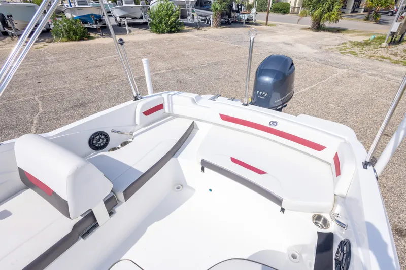 Slide: The Image of 2021 Hurricane SunDeck Sport 185 OB boat interior with seating and Yamaha outboard motor. - 31
