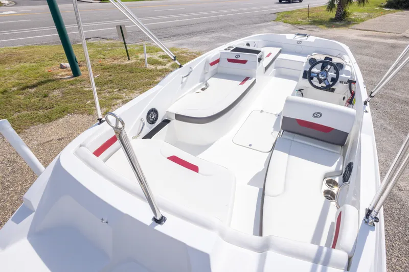 Slide: The Image of 2021 Hurricane SunDeck Sport 185 OB boat interior with white seating and steering wheel. - 17