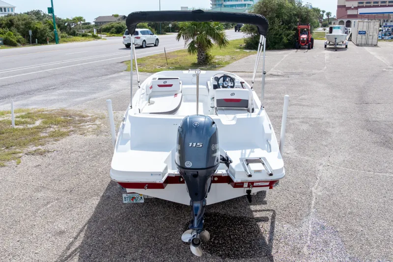 Slide: The Image of 2021 Hurricane SunDeck Sport 185 OB boat with Yamaha 115 engine, parked on a coastal road. - 43