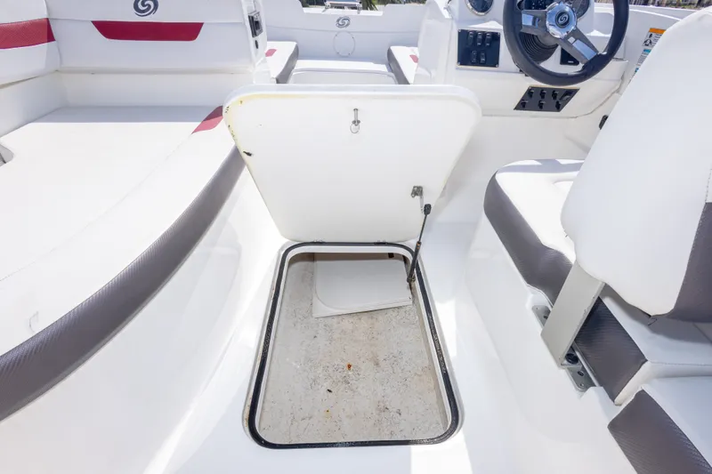 Slide: The Image of 2021 Hurricane SunDeck Sport 185 OB boat interior with open storage compartment. - 34