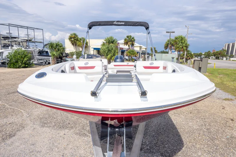 Slide: The Image of 2021 Hurricane SunDeck Sport 185 OB boat displayed outdoors on a sunny day. - 14