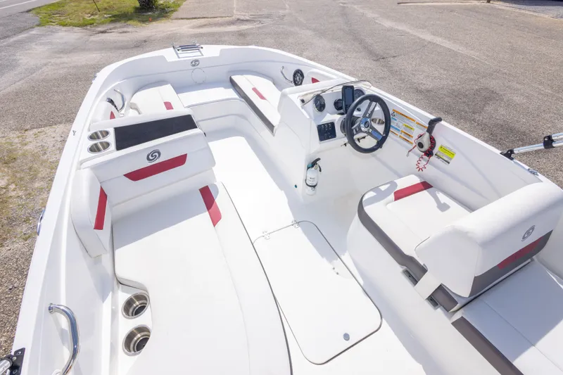 Slide: The Image of 2021 Hurricane SunDeck Sport 185 OB boat interior with white seating and steering console. - 20