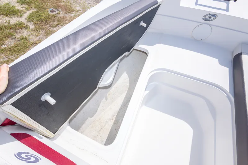 Slide: The Image of 2021 Hurricane SunDeck Sport 185 OB boat interior storage compartment open. - 35
