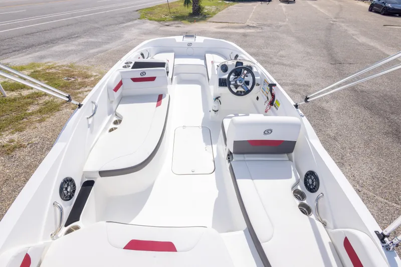Slide: The Image of 2021 Hurricane SunDeck Sport 185 OB boat interior with white seating and steering console. - 19