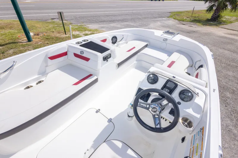 Slide: The Image of 2021 Hurricane SunDeck Sport 185 OB boat interior with steering wheel and seating. - 21