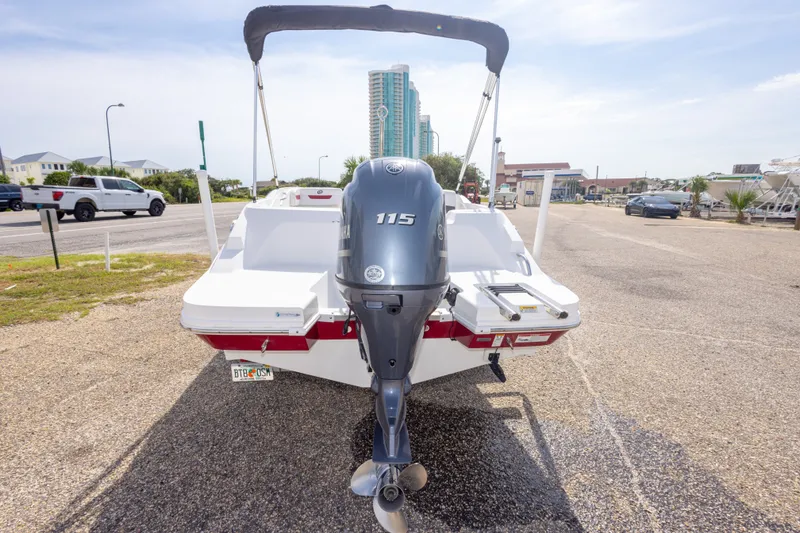 Slide: The Image of 2021 Hurricane SunDeck Sport 185 OB boat with Yamaha 115 outboard motor, parked outdoors. - 39