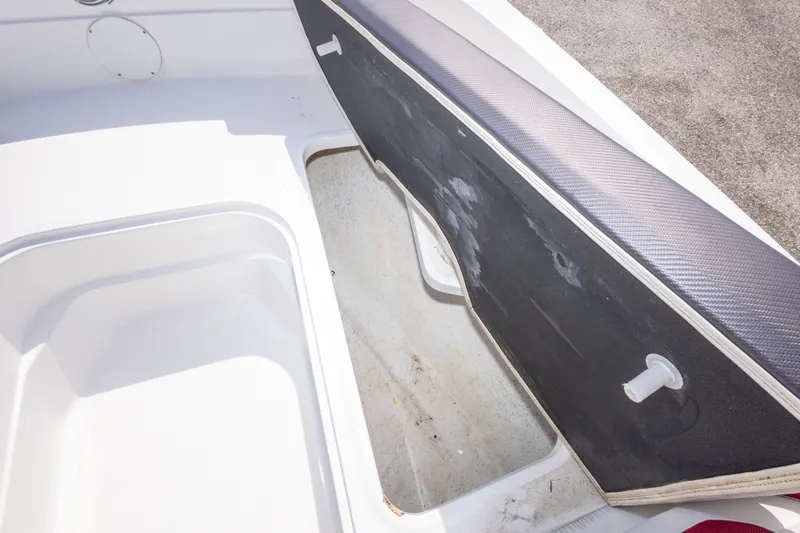 Slide: The Image of Open storage compartment on a 2021 Hurricane SunDeck Sport 185 OB boat. - 36