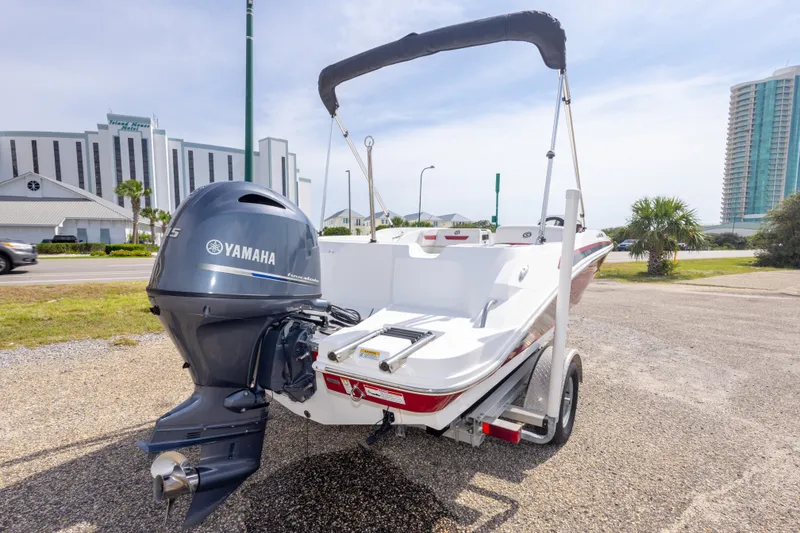Slide: The Image of 2021 Hurricane SunDeck Sport 185 OB boat with Yamaha engine, parked outdoors. - 38