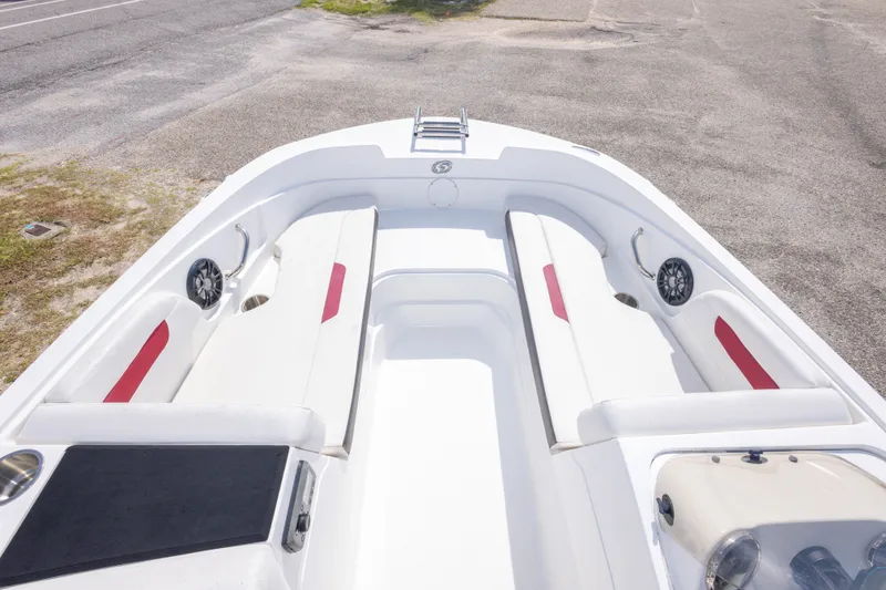 Slide: The Image of 2021 Hurricane SunDeck Sport 185 OB boat interior with white seating and red accents. - 26