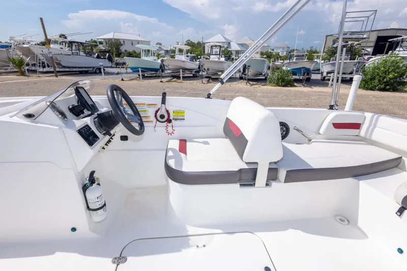 Slide: The Image of 2021 Hurricane SunDeck Sport 185 OB boat interior with steering wheel and seating. - 22