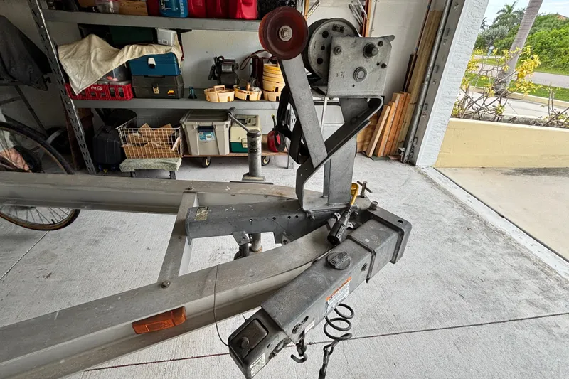 Slide: The Image of Trailer hitch of a 2002 Ranger 2300 Bay Ranger in a garage setting. - 26