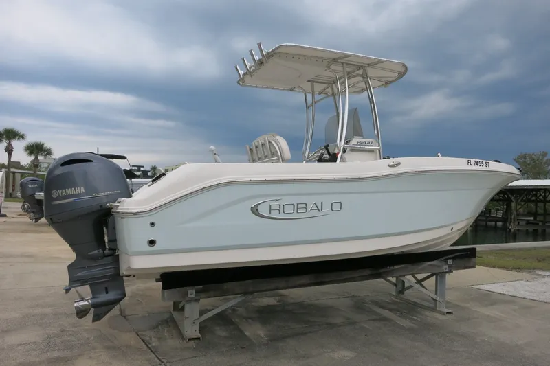 Slide: The Image of 2019 Robalo R200 Center Console boat with Yamaha engine on display. - 2