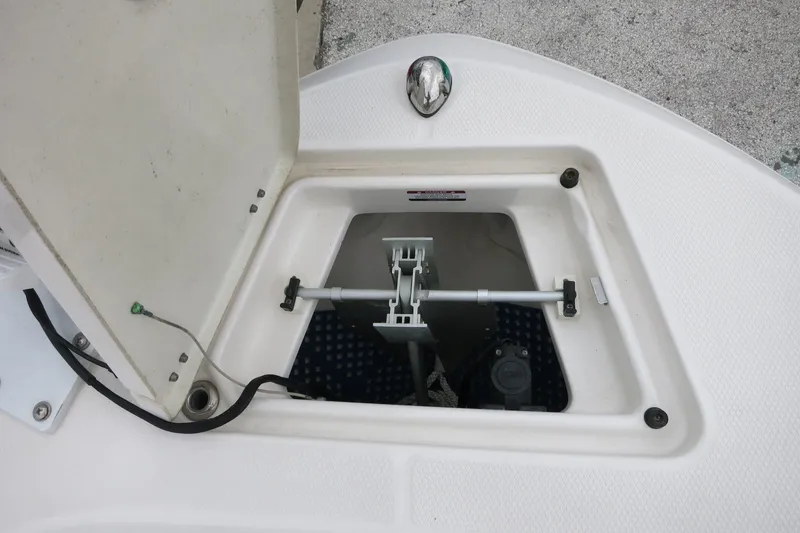 Slide: The Image of Open storage compartment on 2019 Robalo R200 Center Console boat. - 14