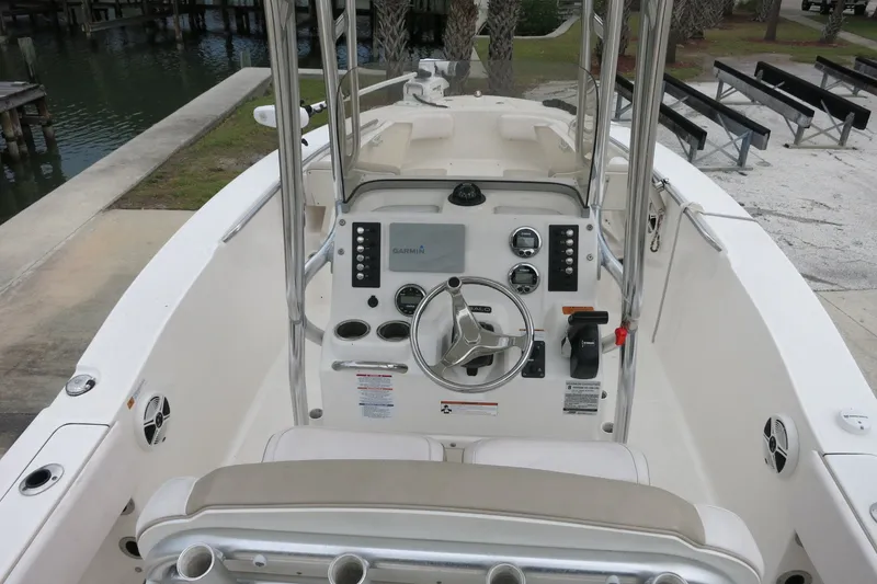 Slide: The Image of 2019 Robalo R200 Center Console boat interior with steering wheel and control panel. - 12