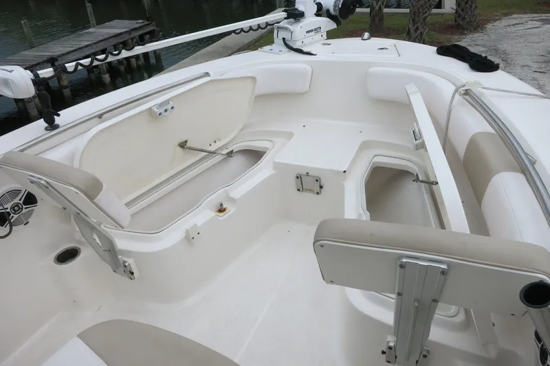 Slide: The Image of 2019 Robalo R200 Center Console boat interior with open storage compartments. - 13