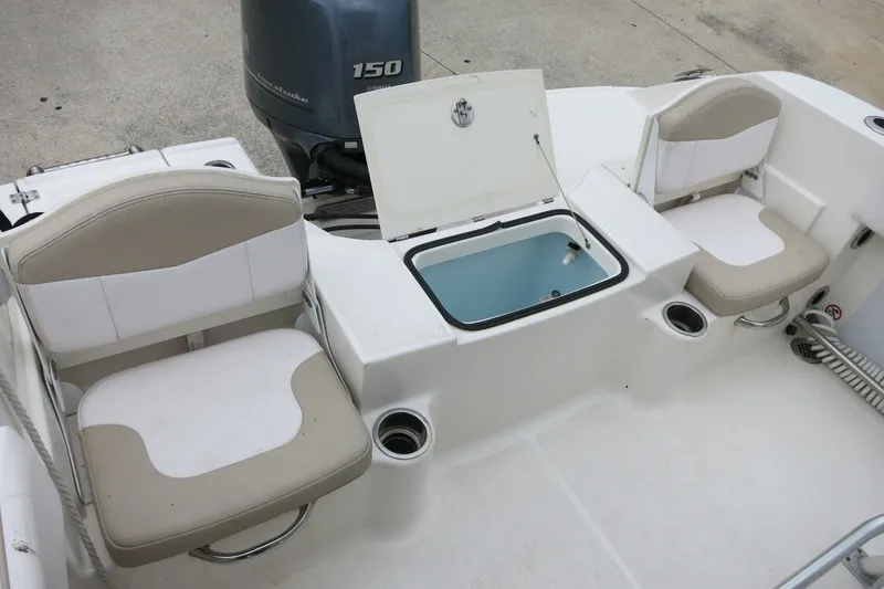 Slide: The Image of 2019 Robalo R200 Center Console boat interior with seating and storage compartment. - 11