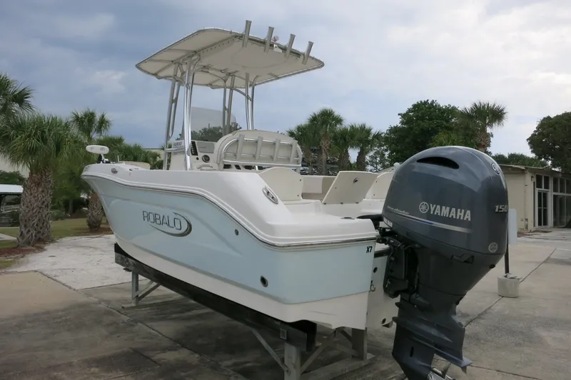 Slide: The Image of 2019 Robalo R200 Center Console boat with Yamaha engine, parked outdoors. - 7