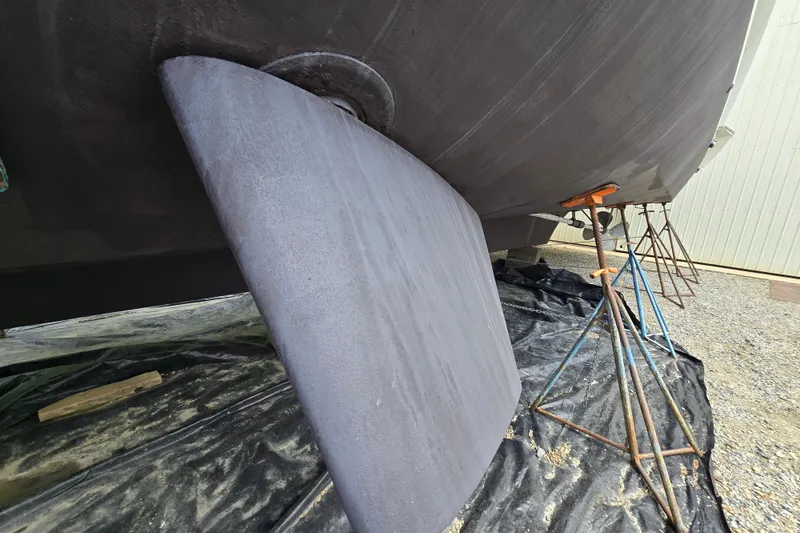 Slide: The Image of Rudder of a 1980 Hatteras 70 Motor Yacht on dry dock. - 35