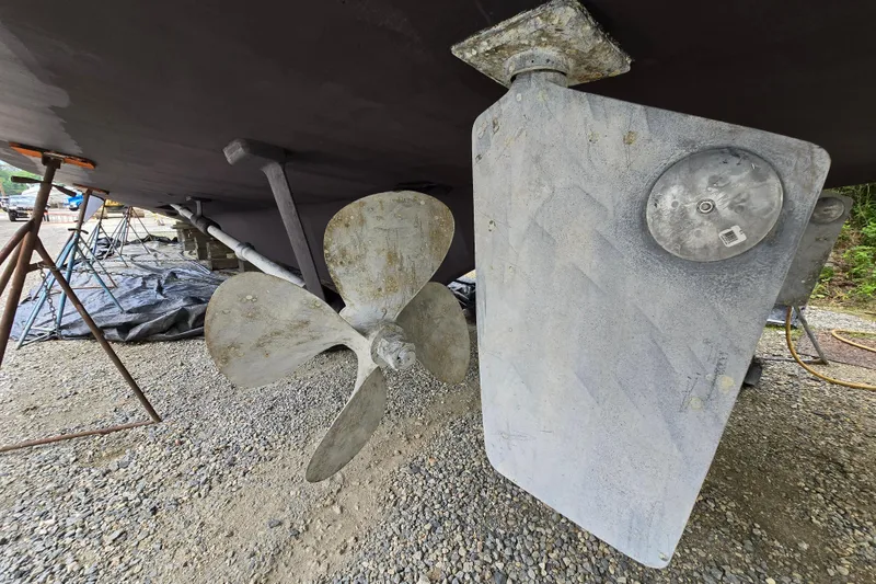 Slide: The Image of Propeller and rudder of a 1980 Hatteras 70 Motor Yacht on dry dock. - 39