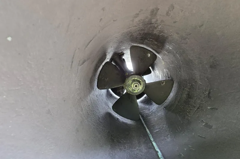 Slide: The Image of Bow thruster of a 1980 Hatteras 70 Motor Yacht, showcasing propeller detail. - 51