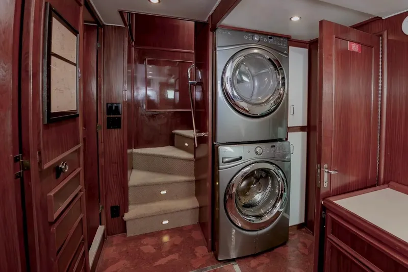 Slide: The Image of Interior of 1980 Hatteras 70 Motor Yacht with stacked washer and dryer. - 24