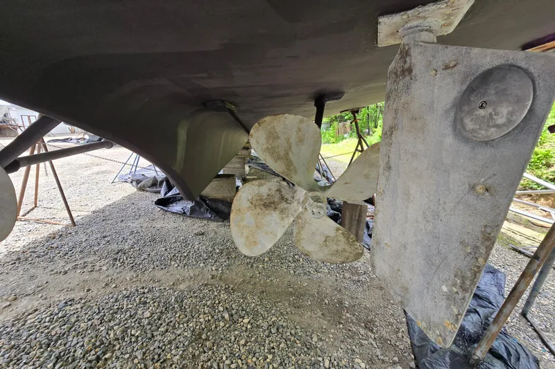 Slide: The Image of Underwater view of 1980 Hatteras 70 Motor Yacht propeller and rudder on dry dock. - 43