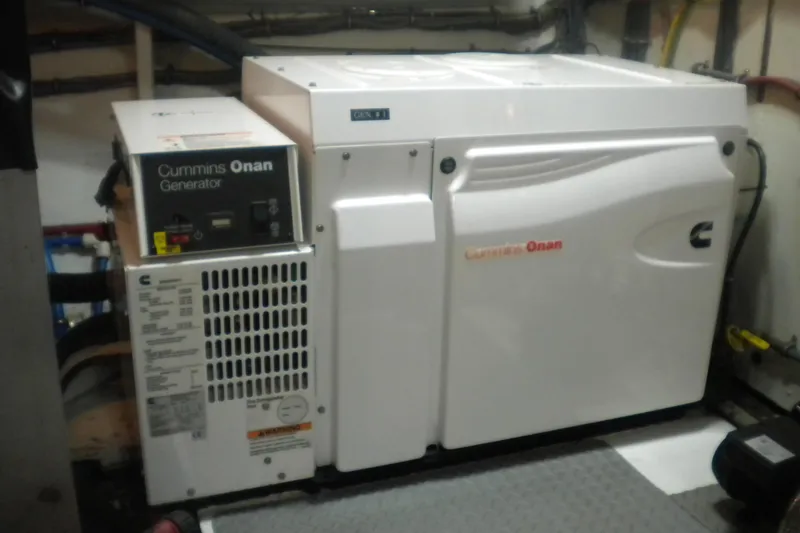 Slide: The Image of Cummins Onan generator in 1980 Hatteras 70 Motor Yacht engine room. - 28