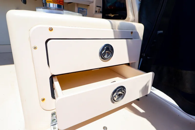 Slide: The Image of Storage drawers on a 2015 Grady-White Sailfish 282 boat, featuring sleek design and functionality. - 18