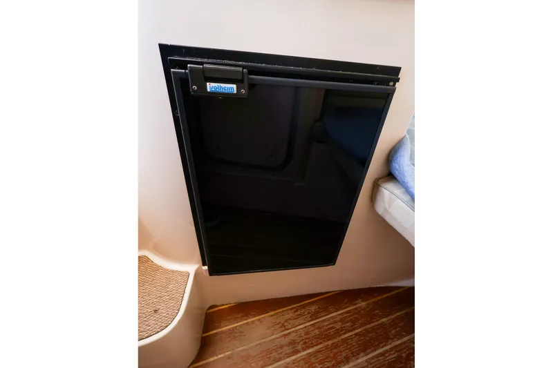 Slide: The Image of Built-in refrigerator on 2015 Grady-White Sailfish 282 boat interior. - 33