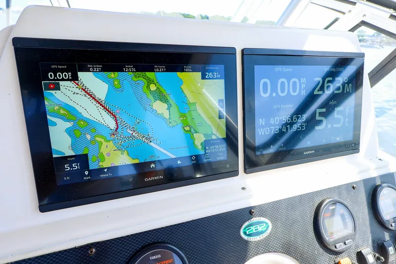 Slide: The Image of Grady-White Sailfish 282 boat dashboard with Garmin navigation displays, 2015 model. - 24