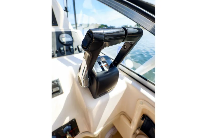 Slide: The Image of Close-up of 2015 Grady-White Sailfish 282 boat throttle controls. - 26