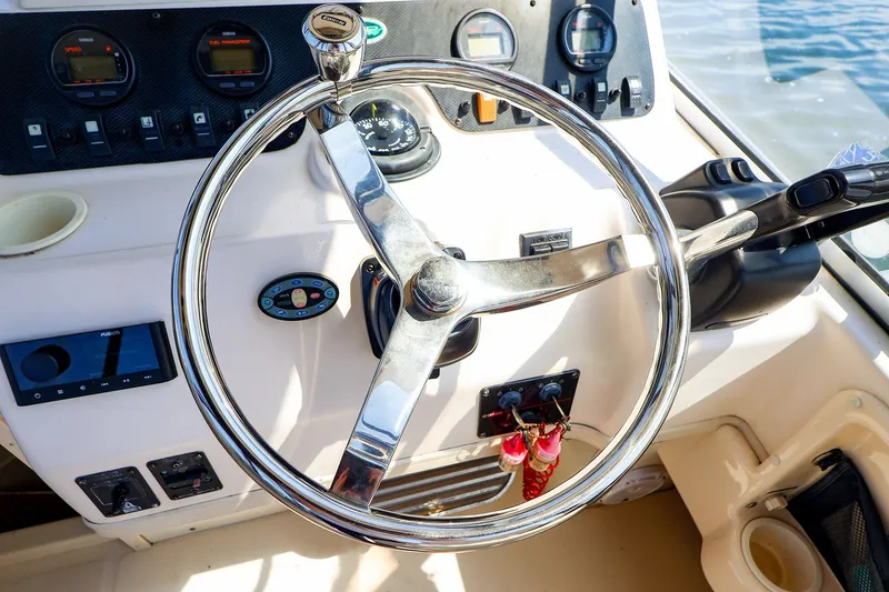 Slide: The Image of Steering wheel and dashboard of 2015 Grady-White Sailfish 282 boat. - 27