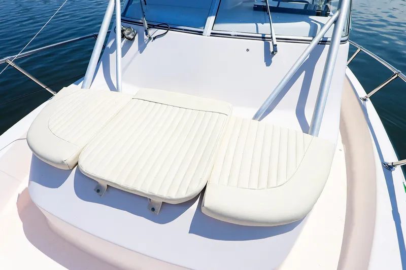 Slide: The Image of 2015 Grady-White Sailfish 282 boat with cushioned seating on deck. - 44