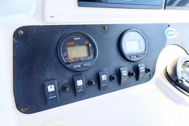 Slide: The Image of Control panel of a 2015 Grady-White Sailfish 282 boat with Yamaha gauges. - 23