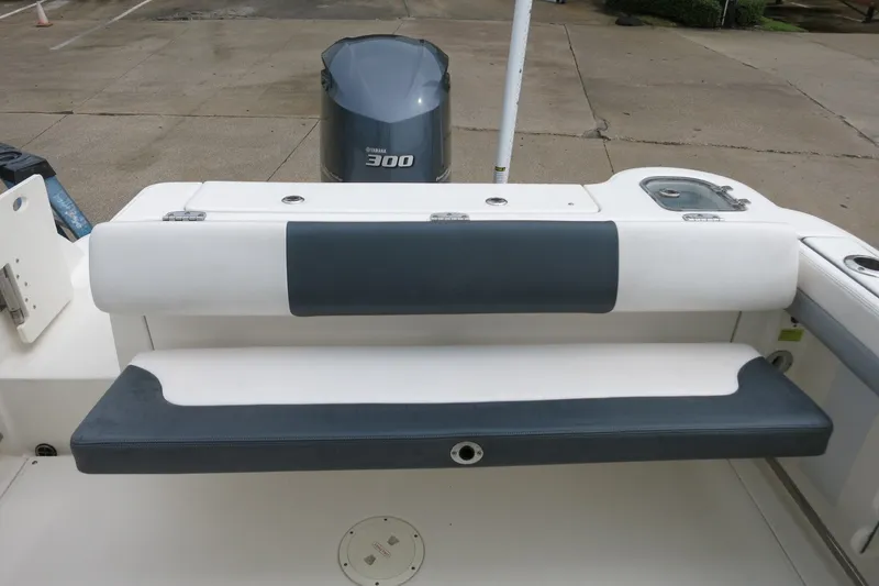 Slide: The Image of 2020 Robalo R247 Dual Console boat with Yamaha 300 engine, featuring rear seating area. - 10
