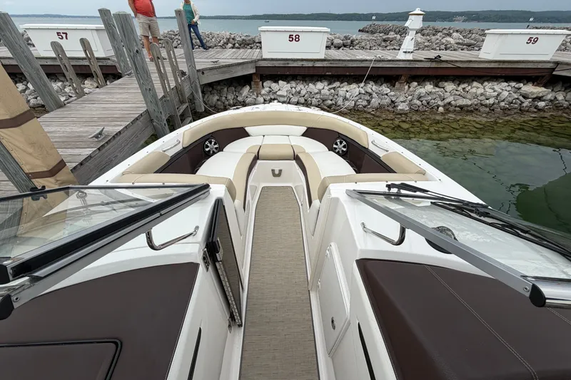Slide: The Image of 2016 Regal 2700 ES Bowrider docked, featuring spacious seating and elegant design. - 22