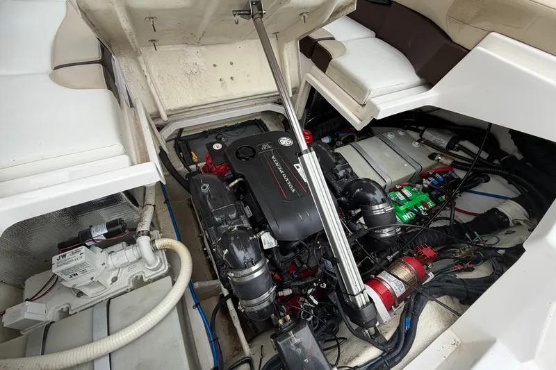 Slide: The Image of Engine compartment of a 2016 Regal 2700 ES Bowrider, showcasing Volvo Penta engine and components. - 23