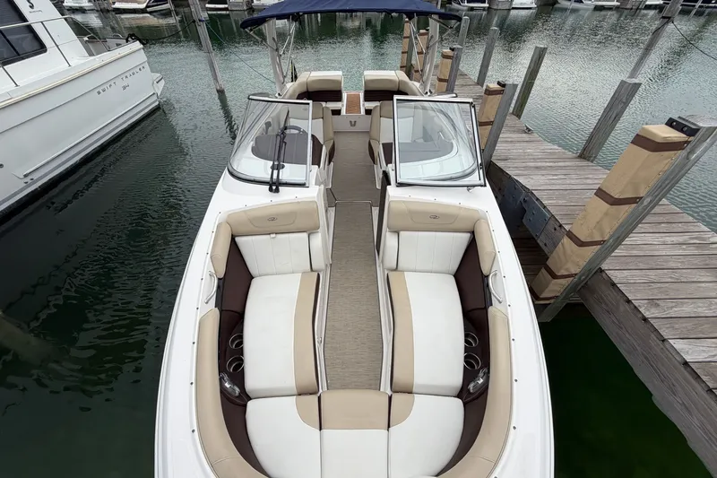 Slide: The Image of 2016 Regal 2700 ES Bowrider docked, showcasing spacious seating and sleek design. - 21