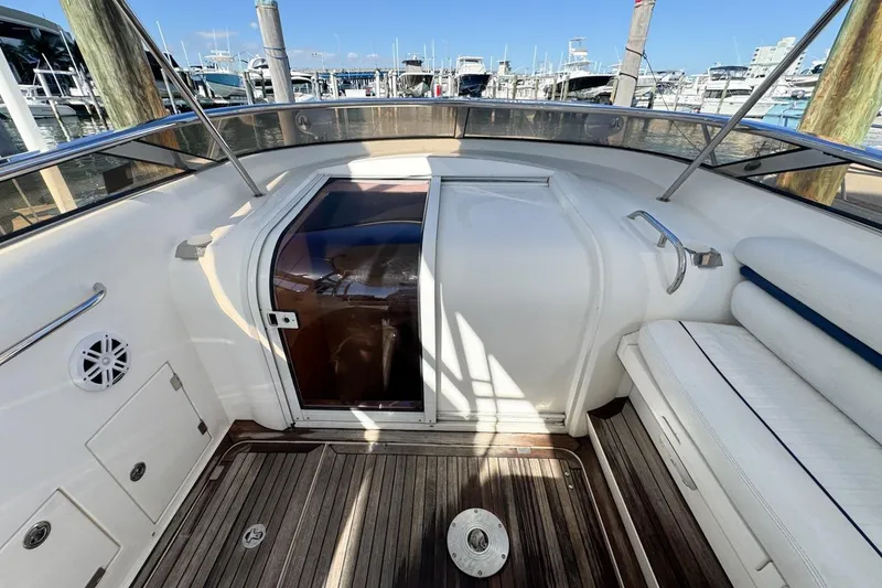 Slide: The Image of 2004 Sunseeker Sportfisher 37 boat interior with wooden deck and seating. - 32